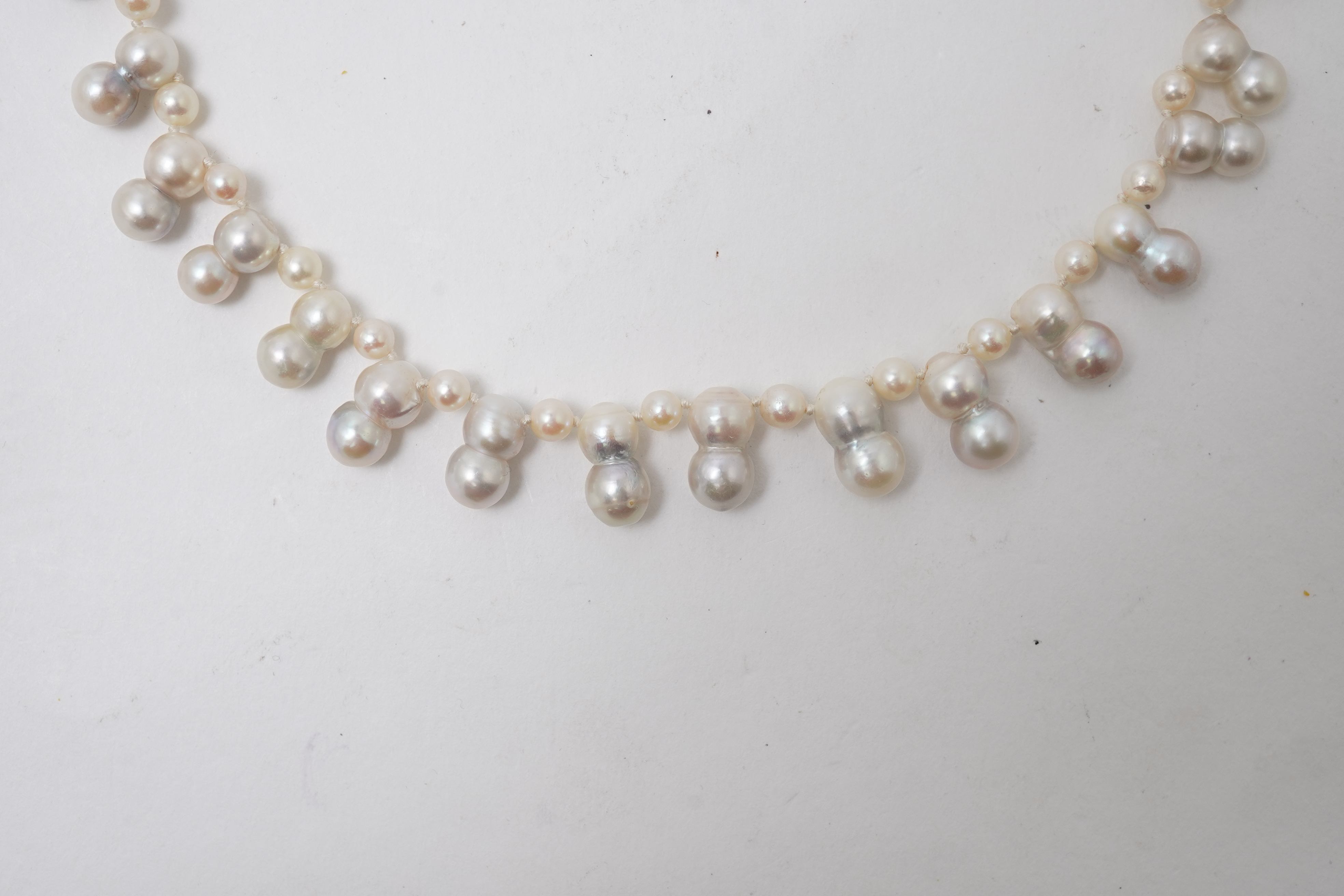 A collection of four cultured pearl necklaces